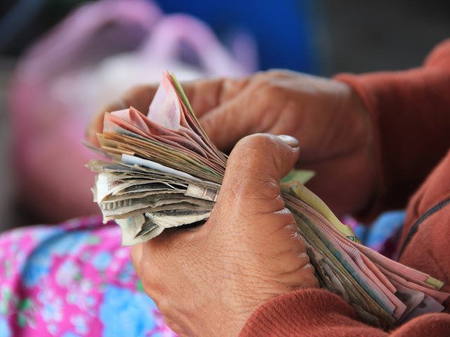 a woman counting money