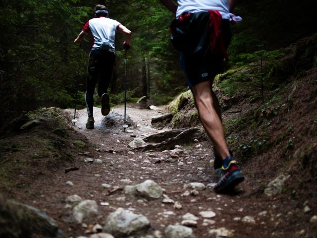 runners on a rocky path