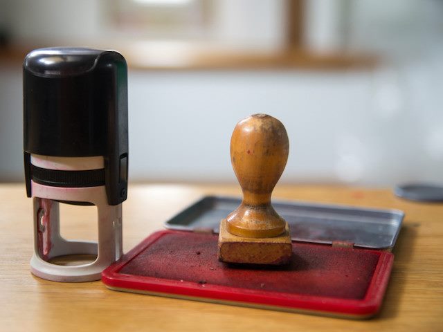 two kinds of stamps, one on ink pad