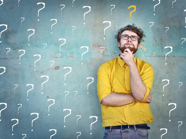 Businessman questioning the difference between a squeeze page and a landing page