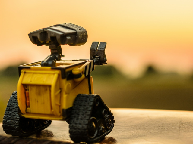 A robot with its "hand" up 