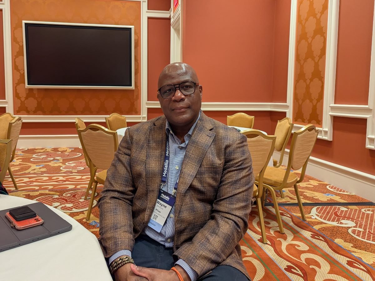 Wayne Simmons of Pfizer posing for a photo at Wynn Las Vegas at Medallia Experience.