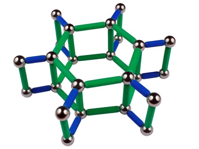 Steel balls and sticks puzzle in blue, green and silver  in  the shape of a crystal lattice, isolated on white background.