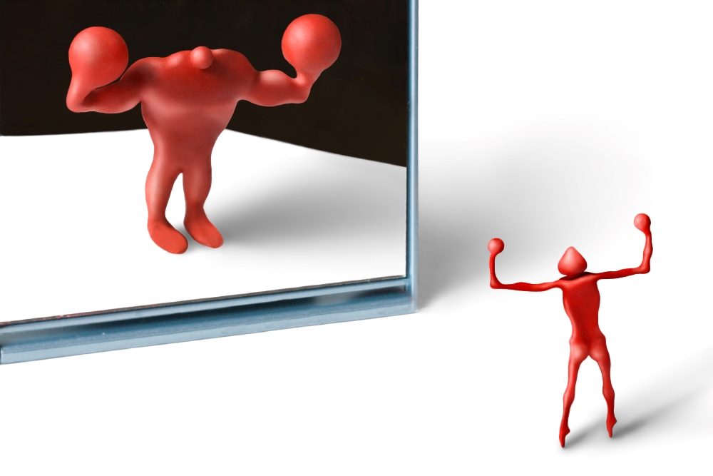 A skinny unmuscled red toy human looks into a magic funhouse mirror and sees what they want to see a strong muscled body in piece about data driven decisions , AI and bias.