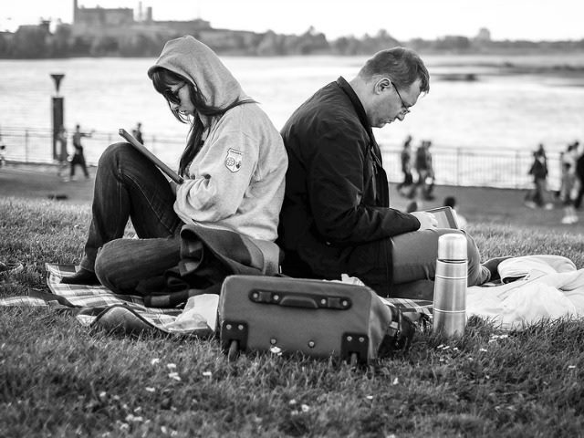 on tablets in a park