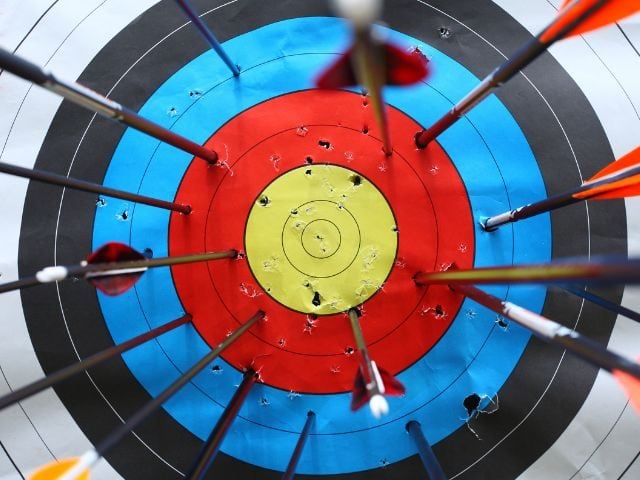 A target with arrows missing the center 