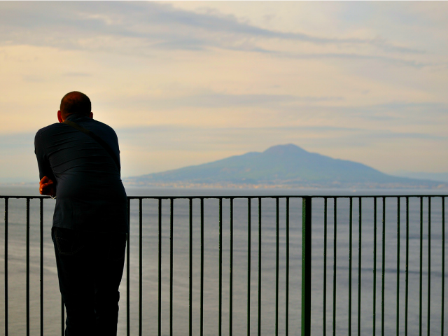 Man looking over a railing