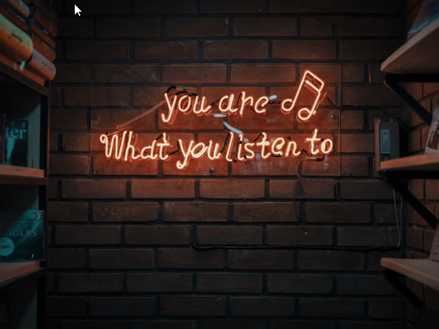 A neon sign that reads, you are what you listen to, hung on a brick wall - customer listening concept