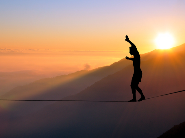 A businessman walking a tightrope - AI, personalization vs privacy concept