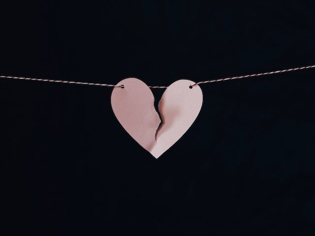 a torn paper heart denoting a break up