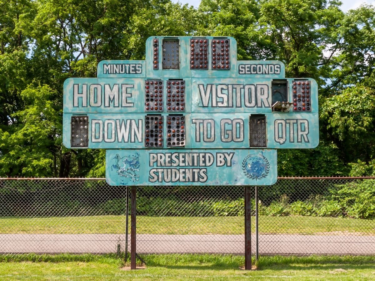 An old football scoreboard on a field in Swissvale, Penn., on a sunny day. 