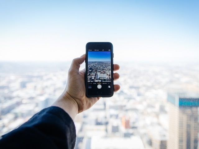 Person taking a picture with a phone