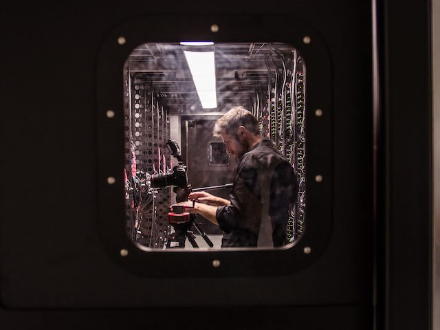 a photograph of a photographer at work in a data center