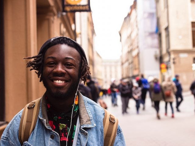 happy man walking up the street