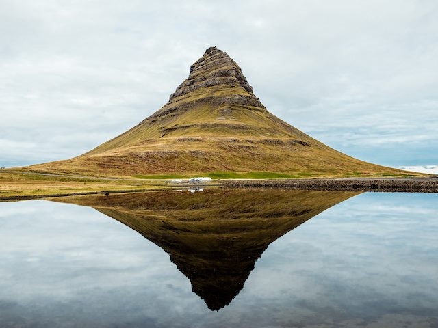 mountain with full reflection in water