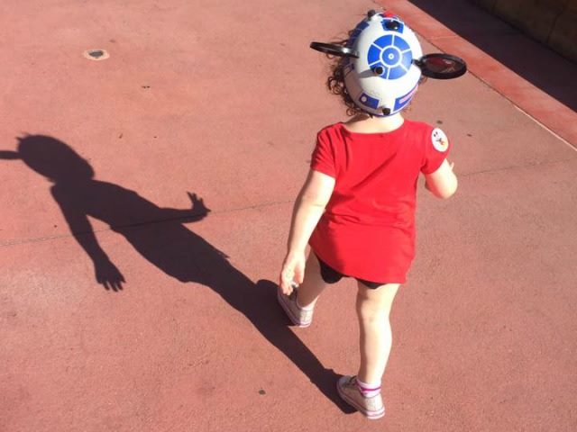 toddler walking at Disney World with Mickey Mouse ears on