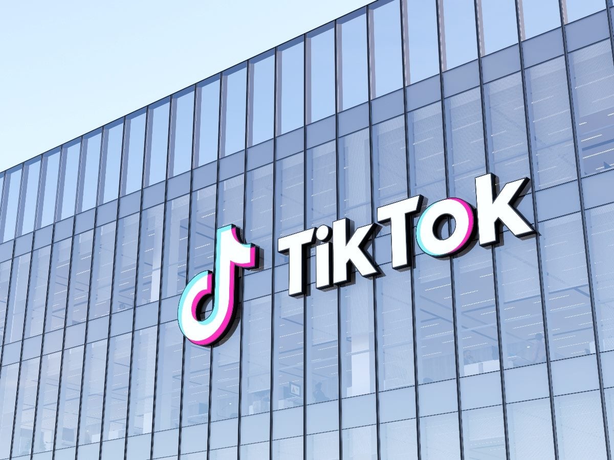 TikTok logo mounted on the exterior of a glass office building at the company’s Culver City, California headquarters.
