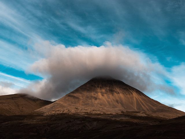 cloud circling a mountaintop