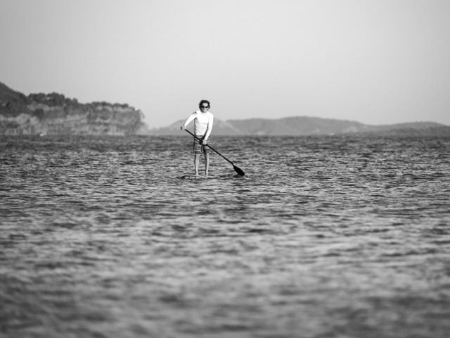 one man on a paddle board