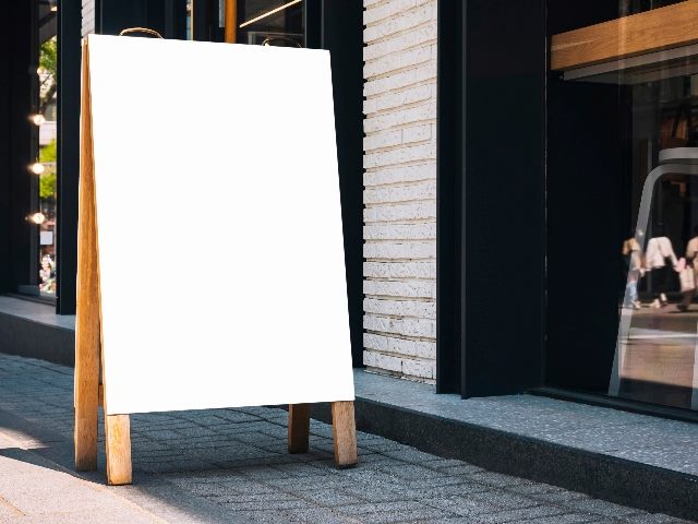 Mock up Signboard Blank sign stand in front of shop. 