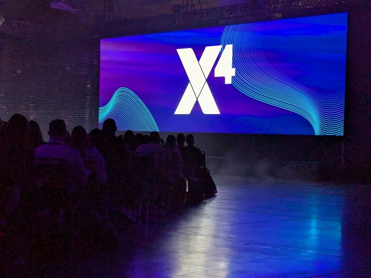 Big X4 logo on a large screen during a keynote at the Qualtrics X4 Experience Management conference at the Seattle Convention Center on March 18, 2026.