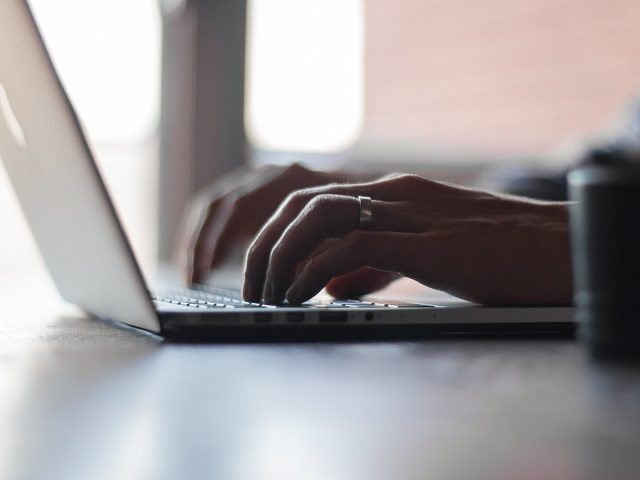 Laptop user collaborating 