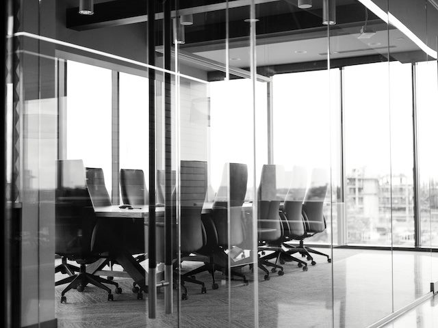 black and white shot of an empty conference room