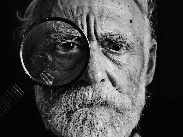 man with a magnifying glass