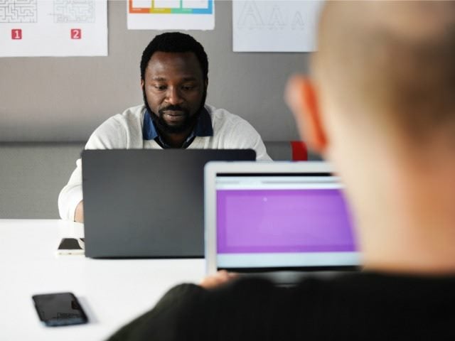 two men working in an office