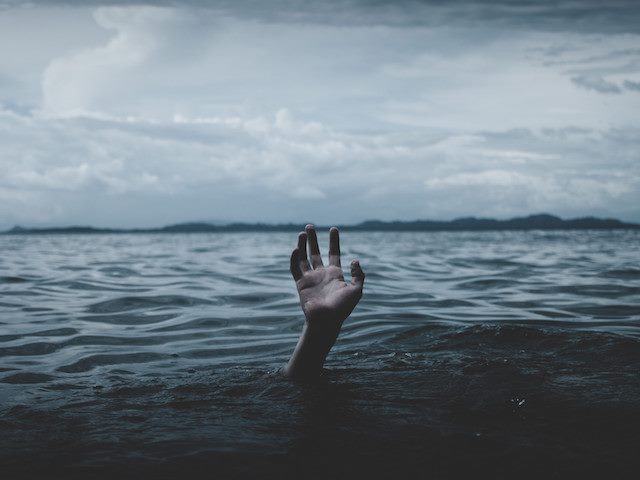 hand sticking up out of water