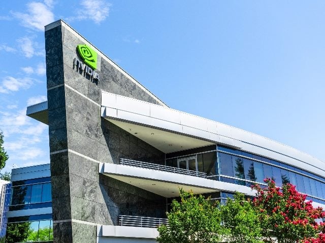 August 9, 2019 Santa Clara / CA / USA - One of the Nvidia office buildings located in the company's campus in Silicon Valley, shot from outside the building. The Nvidia logo and symbol displayed on the facade. 
