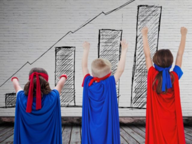 3 kids dressed in superhero capes