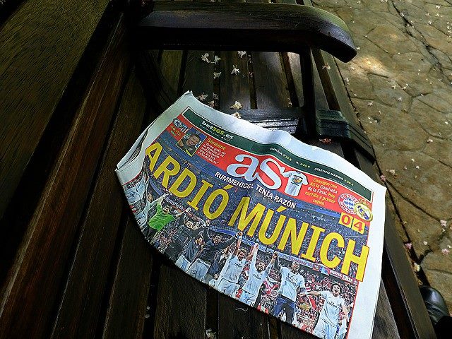 Newspaper on a bench. Headline says, "Ardio Munich."