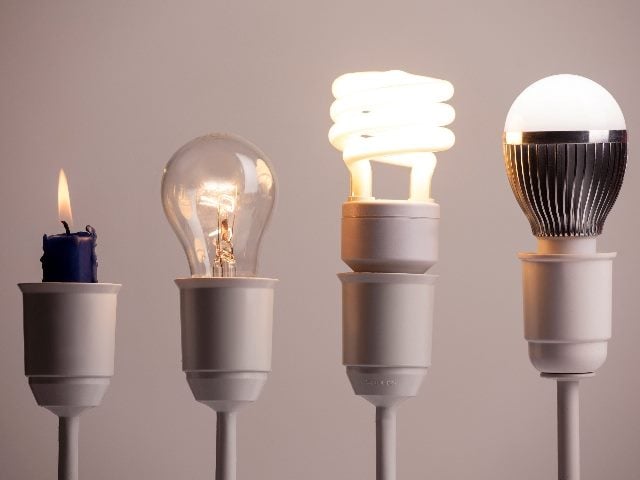  Progress of lighting with, from left to right, a candle, tungsten, fluorescent and LED.