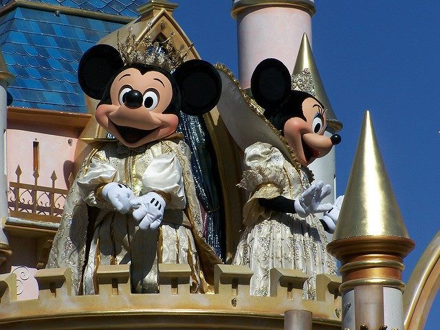 Mickey Mouse and Minnie Mouse performing at Disney World on stage.
