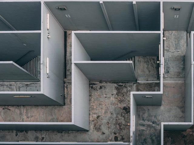the maze of an empty office stairwell from above