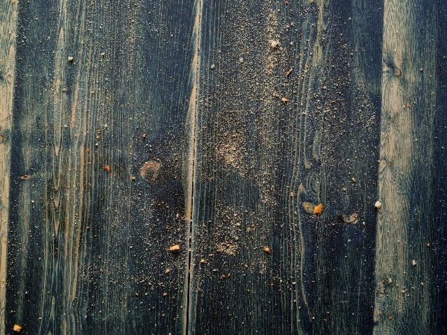 Cookie crumbles on a wooden table.