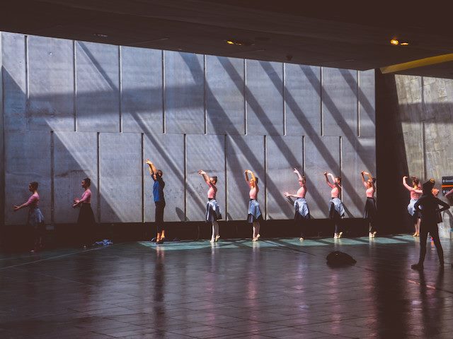 ballerinas lined up against a wall