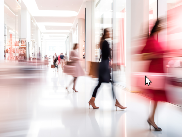 Blurred background of a modern shopping mall with some shoppers.