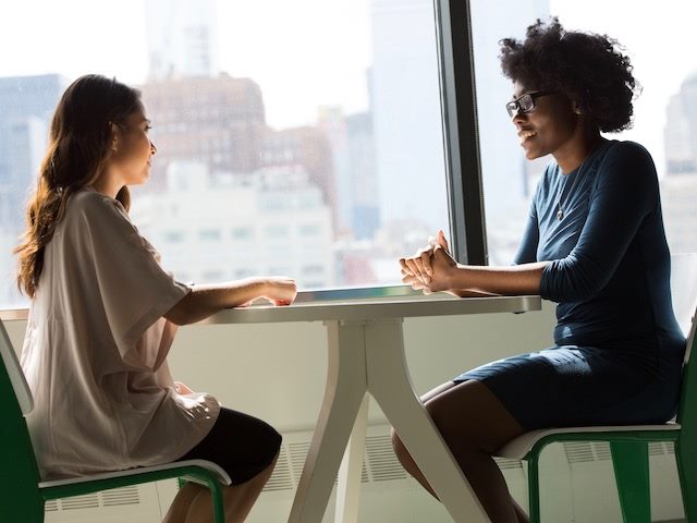 two women having a one on one conversation