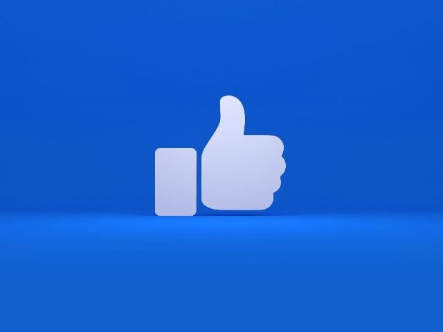 a white Facebook thumbs up "like" 3D icon isolated on blue background indicating the importance of social media strategy.