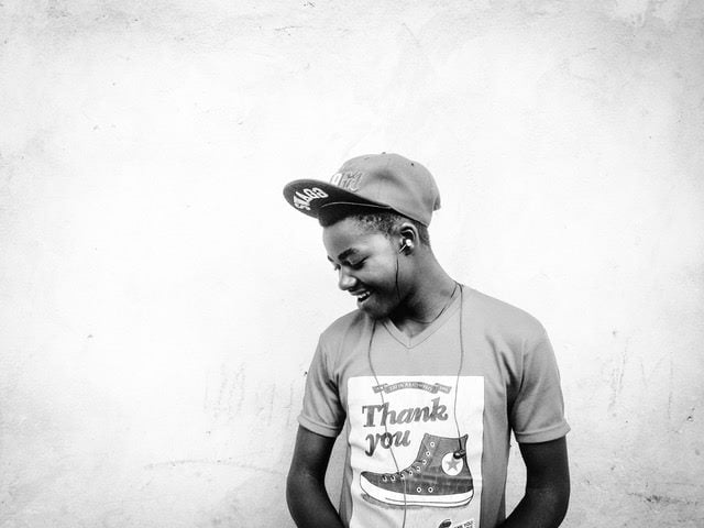 a man wearing a shirt that says 'thank you'
