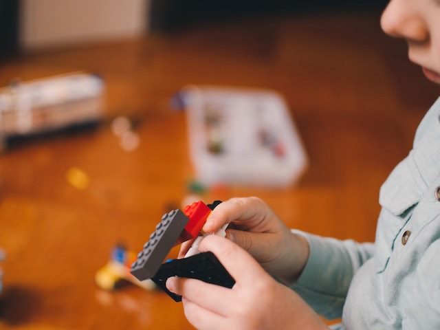 child playing with legos