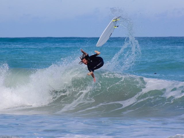 surfer in the air after wiping out