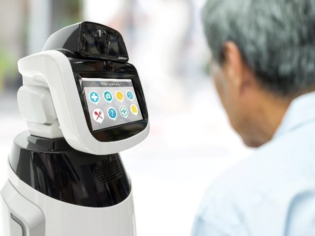 Robot assistant healthcare kiosk-like helper working with a human.