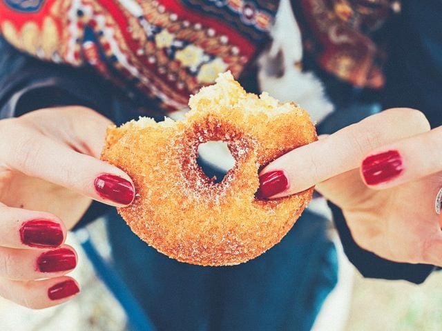 woman eating a doughnut