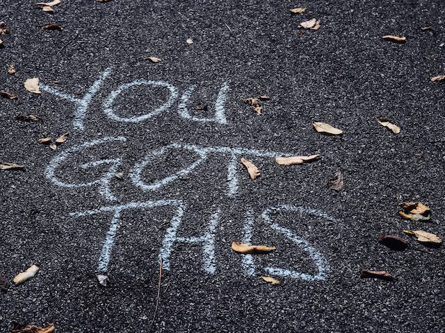 "you got this" written in chalk on a sidewalk