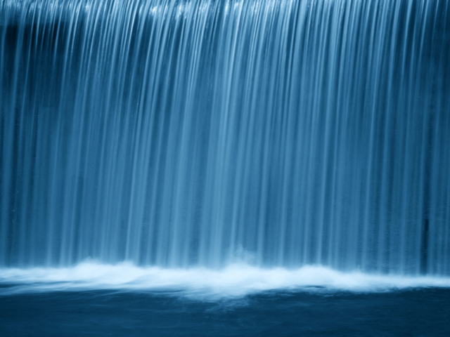 A waterfall at night