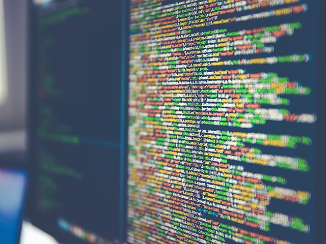 Colorful lines of code on a computer monitor