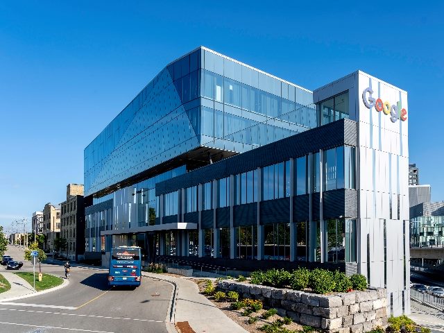 Bus rides in front of Google Canada Kitchener-Waterloo office building. 